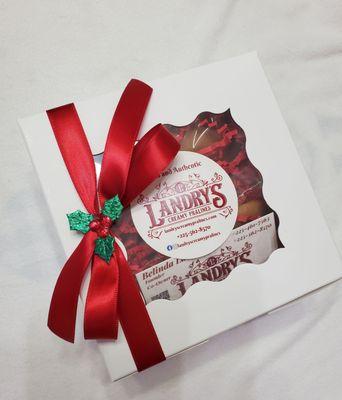 Landry's Creamy Pralines Holiday gift wrap. Complimentary gift wrapping and delicious creamy pralines. Perfect gift for any occasions!