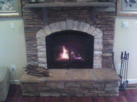 EPA Fireplace with stone wall.