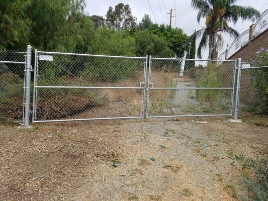 Double drive swing gates on Souther California Edison Property.