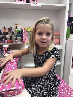 Girls haircut includes hair glitter, braid, and painted nails!