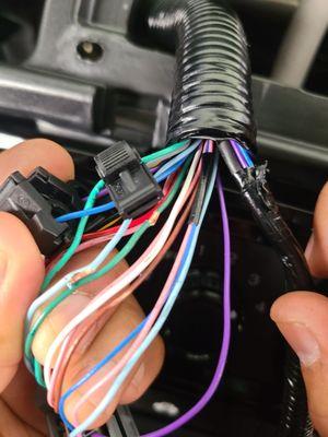 They left wires frayed or stripped. Any of the wires touch metal and would short out the stereo.