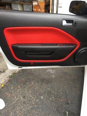 Upholstery Job on a door panel for a Ford Mustang 2010 in color Red!! #fivestarupholstery #car #upholstery #fordmustang #mustang #redpanels