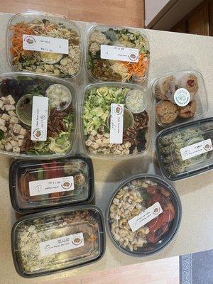 4 salads, chicken w/ snap peas & cashews (2), chicken w/ corn (2), orzo & spinach balls (2), side of veggies, 4-pack of muffins.