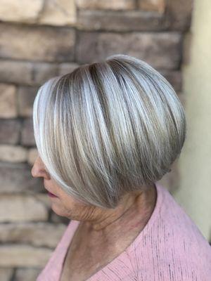 My customer wanted to go back to platinum for easier upkeep. Her natural color is 80% white and 20% gray.