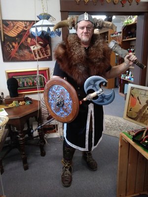 Owner of Second Hand Booty thrift store in Viking costume for Halloween