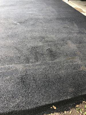 Rake marks left on finished topping job where not enough asphalt was used to give a finished surface after compaction roller