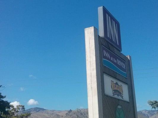 View of Saddle Rock with the sign.