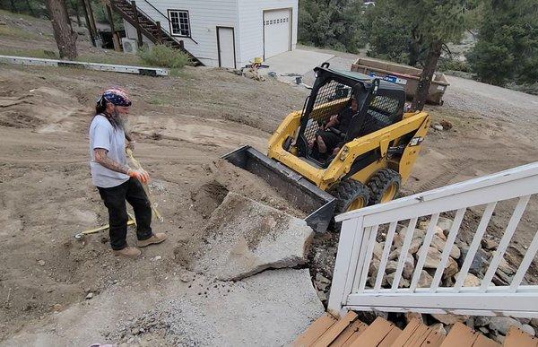 Get Trash'd removing old walkway.