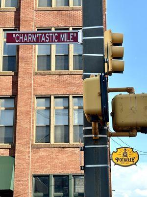 The Iconic Charm'tastic Mile Street Sign in the Dwtn-West corridor of the city near Oriole Park and M&T Bank Stadium.