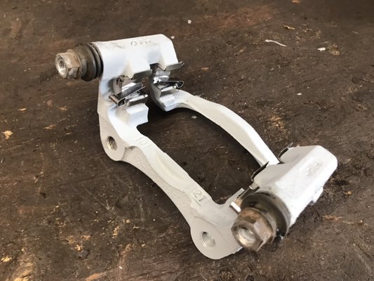 Sandblasted caliper bracket painted with anti corrosion paint and new pad guides