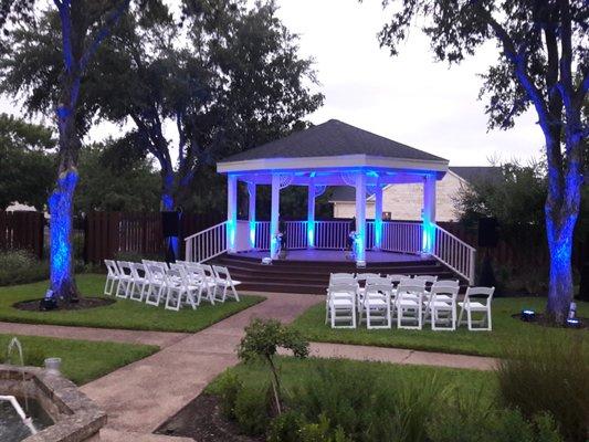 Up lighting under the gazebo and along the trees at Victoria's Tea House & Garden in Round Rock, TX