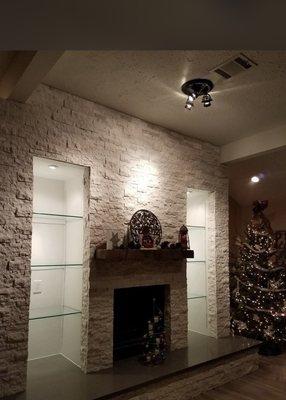 Completed project! Weathered wood mantle, recessed lighting, lights added in ceiling and glass shelves!