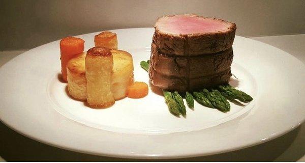 Beef tenderloin, Pan seared potato and carrots, asparagus, red wine sauce.