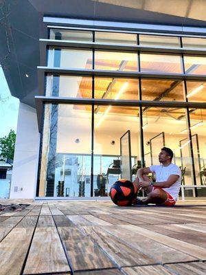 Outdoor deck and apex view of cardio machines.