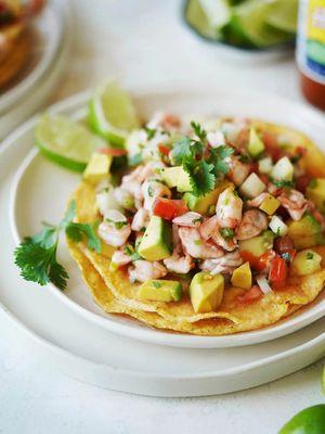 Sonora ceviche de camaron. Fresh shrimp, diced avocado, tomatoes, onions, cilantro. Lime & tomato juice, Mexican herbs & spices.