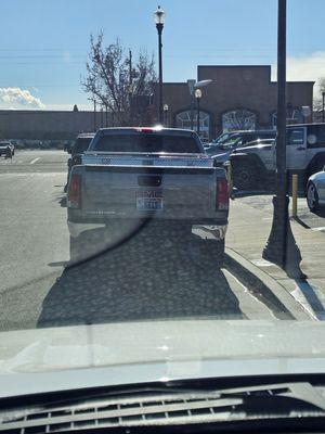 Dealer plate on the truck he just bought for "himself"