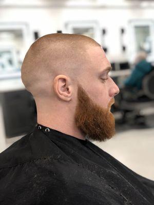 Skin fade with beard done by Gusto the barber.