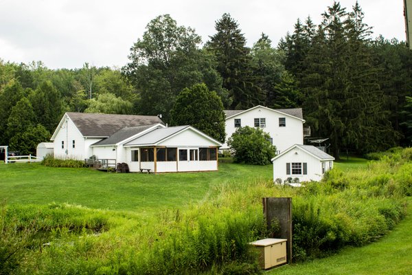 You can see the enclosed dining area, and kitchen. The bathrooms/showers are also located off the kitchen.