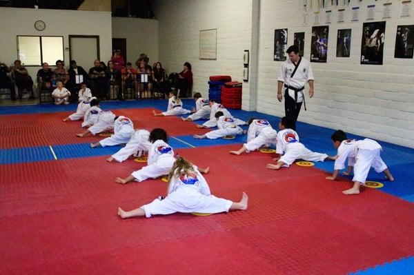 Our younger students, 4-6 years old, stretching during belt testing!