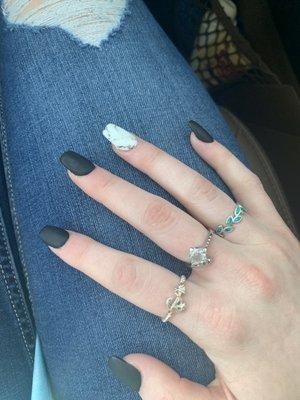 I asked for matte black acrylics with a white marble ring finger and I'm very impressed with how they turned out.