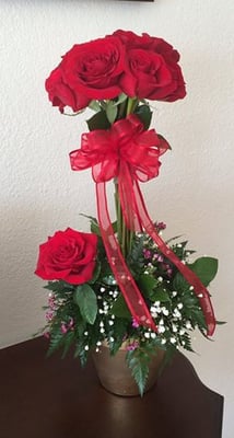 Our unique dozen rose topiary will let him/her know just how special they are...