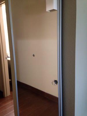 Full size mirror doubles as the closet door.