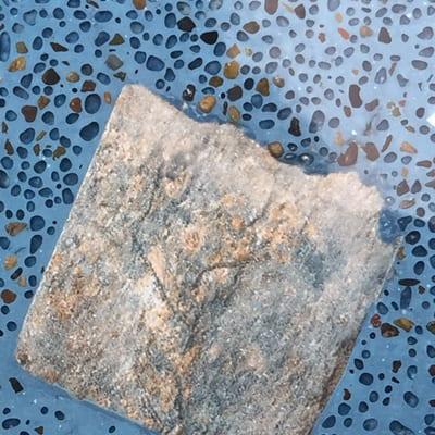 Tiles left covered in blue bonding material