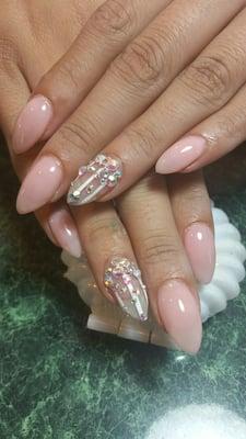 Pink almond shaped nails with iridescent crystals. Line art work. Text 2102406021 for appointments