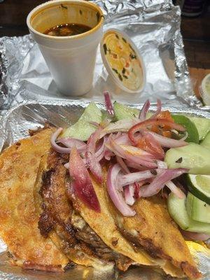 Quesobirria tacos and their consomé.