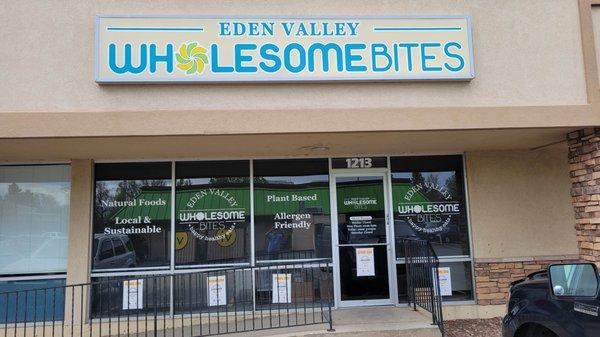 New overhead translucent lighted sign front and window graphics.