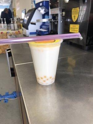 Vanilla Bubble tea with popping mango boba