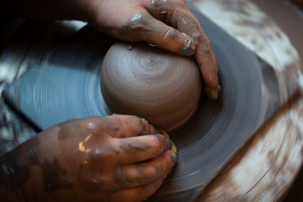 Wheel throwing class on the pottery wheel