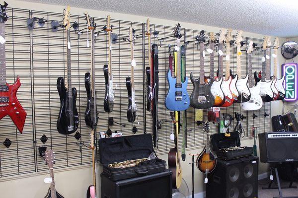 Guitars and other musical instruments at Welsh Pawn Shop Skidaway Road Savannah, GA 31404.