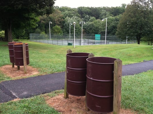 Trash cans and tennis courts