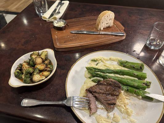 Brussels mashed potatoes steak asparagus and they bring fresh sourdough bread with herb butter! Amazing! It's in the Hyatt Hotel!