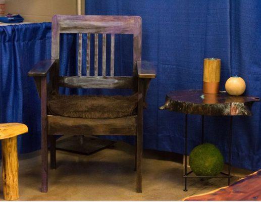 Refurbished chair with unicorn spit, and red cedar side table in black resin