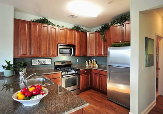 Chef's kitchen with granite countertops, stainless steel appliances & 42" cabinetry!