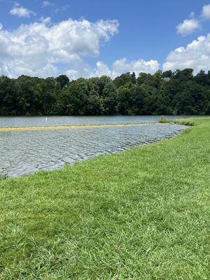 The edge of the grass goes right up to swimming area. No sand for kids. Just grass then lake.