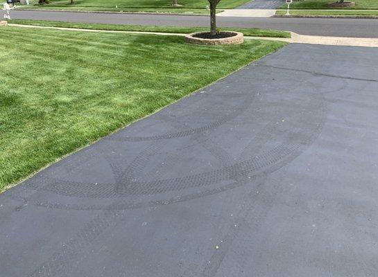 Tire marks left behind on my driveway from Frazier lawn mower.