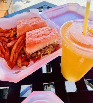 Cuban sandwich with grilled onions and a mango smoothie