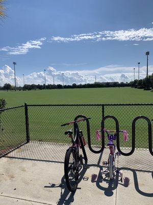 Bike parking and wide open fields but no kite flying allowed.