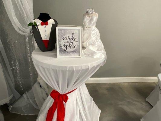 Brides dress and Grooms tux decoration card table.