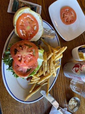 Burger with extra tomatoes.