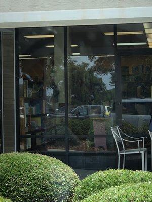 From what I can see through the window it looks like a library. Lots of room between shelves of books.