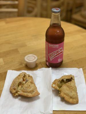 L to R: Chicken Fajita Empanada (~$2.25), Cheeseburger Empanada (~$2.15), Postobon Manzana Bottle (~$2), and Pink Sauce.