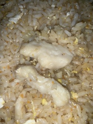 Uncooked, slimey chicken fried rice.