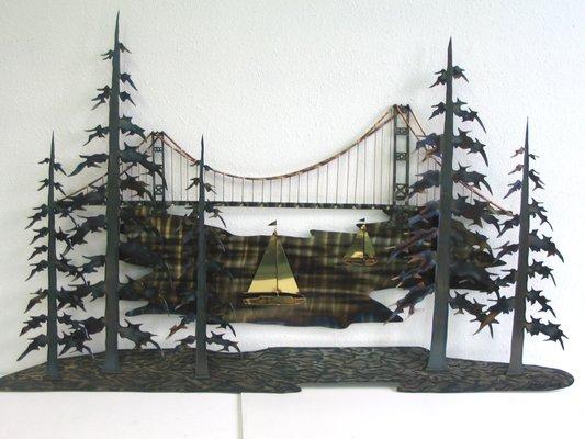 Metal art bridge and trees by Stuart Hurd