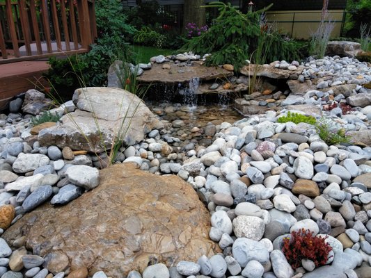 Somerset NJ Designed and installed waterfall feature poolside.