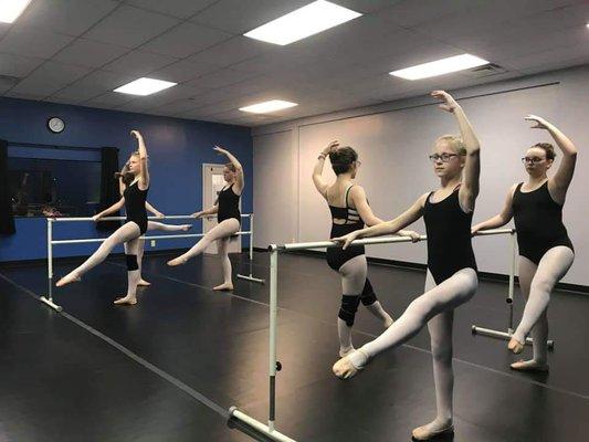 Our competitive team working hard in ballet class.