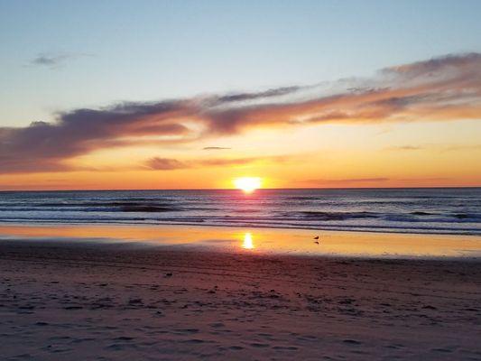 The Sunset in front of Sea Spray Oceanfront Lodging in Lincoln City Oregon